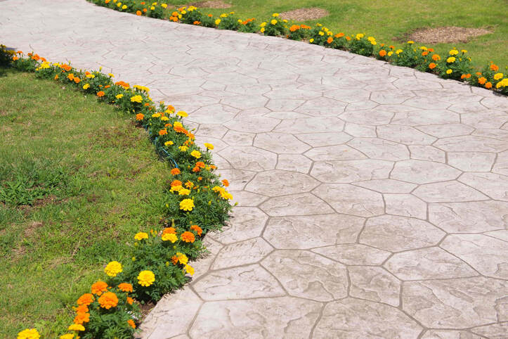 The decorative concrete that was chosen for this pathway was stamped concrete. The design is very elegant yet simple. 