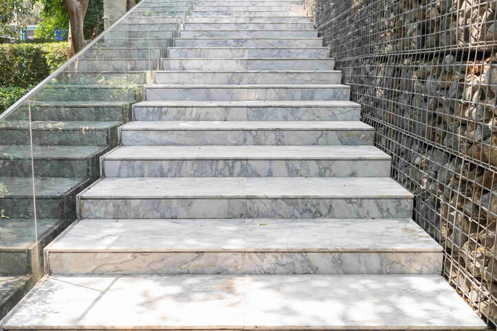 This is a concrete staircase that is mimicked to look like marble. This was installed for a commercial property in Vancouver. 