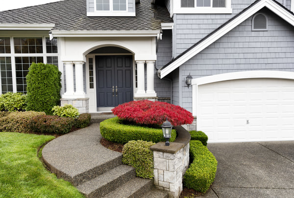 The home owner of this detached Vancouver home wanted his stairs to match the exposed aggregate driveway that was already in place. 